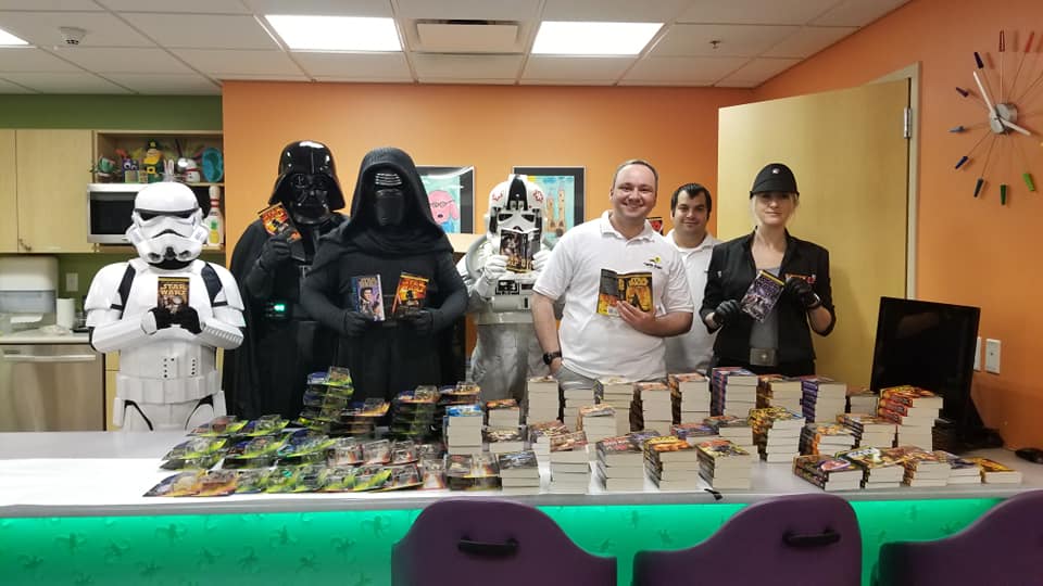 Twin Suns at a Children's Hospital with the Imperial 501st with all the books being donated
