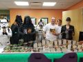 Photo of The Dune Sea Garrison of the 501st and the Twin Suns Foundation Volunteers at Phoenix Children's Hospital witht the books and action figures donated